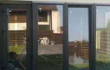 Скління веранди з вхідними дверима та профілем Rehau Euro 60 у кольорі антрацит